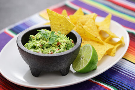 homemade guacamole with tortilla chips, Mexican appetizer