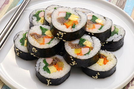 Gimbap is a Korean food consisting of rice and several ingredients seasoned with sesame oil and wrapped in nori seaweed.の素材 [FY310197880402]