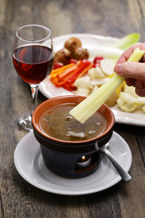 Bagna cauda(Italian Piedmont cuisine)Â Â is a hot dip made from garlic and anchovies. 
The dish is served with raw or cooked vegetables typically used to dip into it.の写真素材