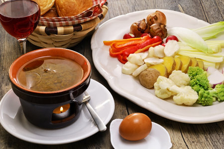 Bagna cauda(Italian Piedmont cuisine)Â Â is a hot dip made from garlic and anchovies. 
The dish is served with raw or cooked vegetables typically used to dip into it.の素材 [FY310199083644]