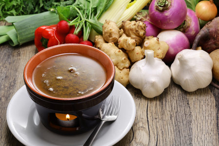 Bagna cauda(Italian Piedmont cuisine)Â Â is a hot dip made from garlic and anchovies. 
The dish is served with raw or cooked vegetables typically used to dip into it.の写真素材