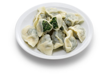 homemade Shepherd's purse and pork dumplings, Chinese food isolated on white backgroundの写真素材