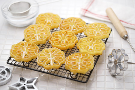 rosette cookies ( flower ) on a cake cooling rackの写真素材