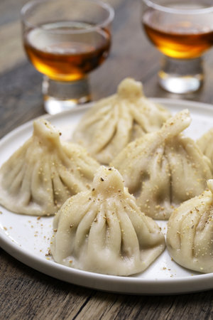 homemade khinkali dumplings with chacha (Georgian pomace brandy ), Georgian cuisineの写真素材