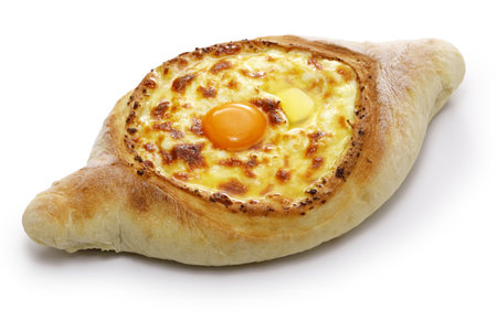 homemade adjaruli khachapuri ( A boat-shaped traditional cheese bread from the Adjara region of Georgia ) isolated on white backgroundの写真素材