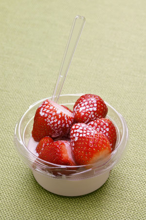 strawberries and cream, a small bowl, English summer specialtyの写真素材
