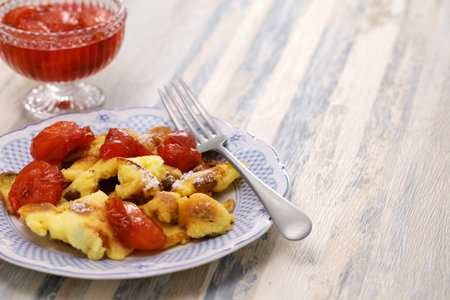 Kaiserschmarren mit Pflaumenkompott, Austrian fluffy scrambled pancake with plum compoteの写真素材