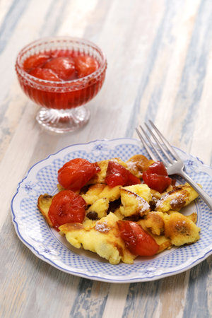 Kaiserschmarren mit Pflaumenkompott, Austrian fluffy scrambled pancake with plum compoteの写真素材