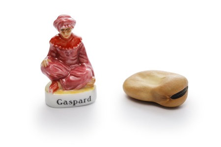 small porcelain doll and broad bean to hide in RoscÃ³n de Reyes (Spanish Kingâs cake).の写真素材