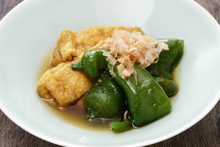 a simmered dish of Manganji togarashi (sweet chili pepper ) and fried tofu, Kyoto home cooking in Japan.の写真素材