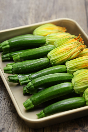 zucchini flowers in a trayの写真素材