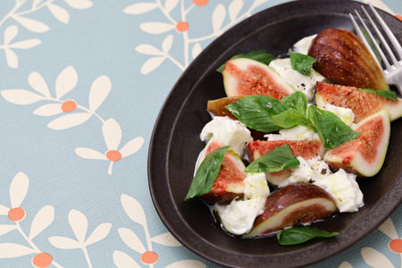 fig caprese salad(fig, mozzarella and basil)の写真素材