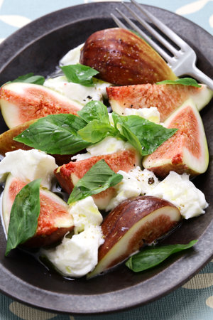fig caprese salad(fig, mozzarella and basil)の写真素材