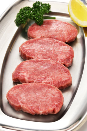 sliced beef tongue.
Beef tongue is one of the popular ingredients for Yakiniku (Japanese-style barbecue).の写真素材
