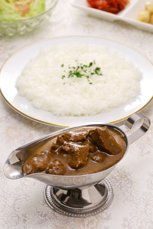 Japanese-style beef curry rice ( curry and rice are served separately)
Japanese curry is always served with rice.の写真素材