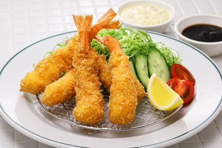 Ebi fry (Japanese fried shrimp), freshly fried.
Japanese Ebi Fry is shrimp that has been peeled, coated in flour, dipped in egg batter, then breaded and fried in oil.の写真素材
