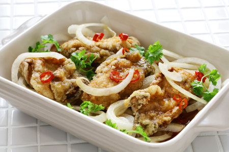 Oyster escabeche, battered and fried oysters marinated with vinegar sauce.の写真素材