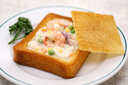 coffin bread, Taiwanese food.
It is white bread that has been fried in oil, with the center hollowed out and stuffed with seafood chowder.の写真素材