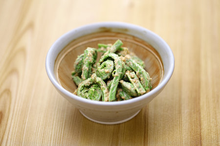 boiled fiddlehead (Ostrich fern) tossed with walnut dressing, Japanese cuisineの写真素材