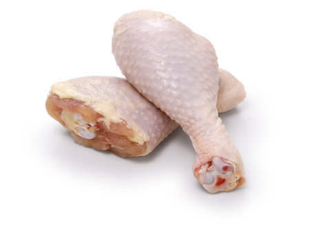 raw chicken drumsticks isolated on a white backgroundの写真素材