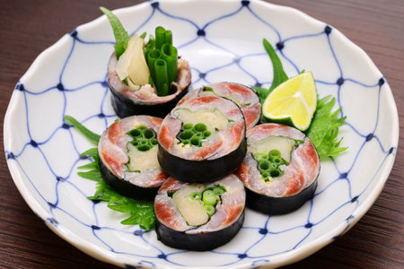 Pickled sardines and ginger wrapped in nori seaweed, A Japanese sushi restaurant roll dish.の写真素材