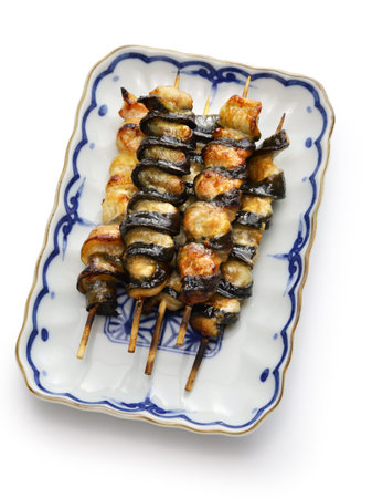 Kurikara-yaki (charcoal grilled eel skewers), Japanese unagi dish isolated on white backgroundの写真素材