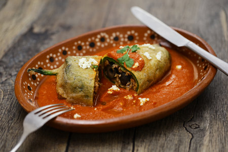 chile relleno (fried poblano pepper stuffed with minced meat and coated with egg meringue), Mexican cuisineの写真素材
