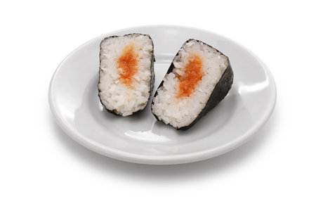 Onigiri(rice ball) cut in half. The filling is mentaiko(spicy fish roe). Traditional Japanese food.の写真素材