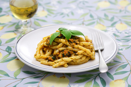 Busiate alla Trapanese is made from a specialty pasta from the province of Trapani called Busiate, then boiling it and tossing it in a Trapanese sauce made primarily from almonds.の写真素材