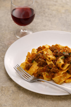 Homemade pappardelle pasta with lamb ragu sauce. Italian cuisine.の写真素材