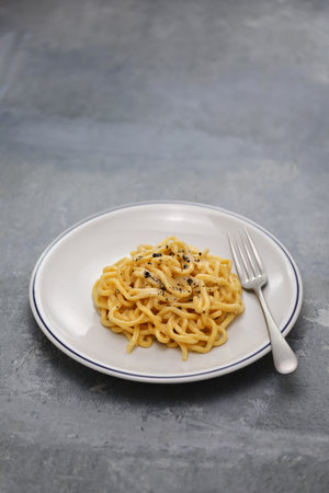 cheese and pepper pasta (tonnarelli cacio e pepe), traditional cuisine of Rome, Italyの写真素材