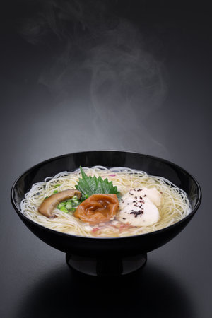 Nyumen, Boiled somen (Thin noodles made from flour. Sold in dried form ) poured with hot noodle soup base. Japanese cuisine.の写真素材