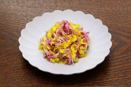 Japanee sweet and sour salad made of yellow and purple chrysanthemum flowers.の写真素材