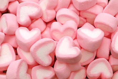 Heart-shaped marshmallows. Happy valentine's day background material.