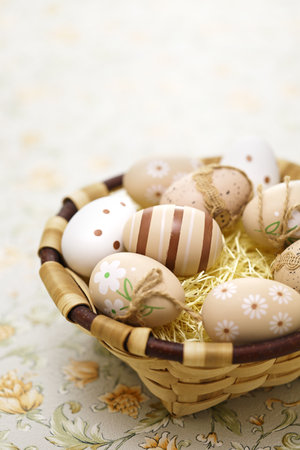 Simple, calm and coloring beautiful easter eggs in the basket. Greeting card design. copy space.の写真素材