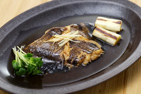 Boiled flatfish in a broth of sweetened soy sauce-based dashi, Japanese cuisineの写真素材