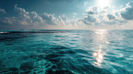 This captivating ocean scene features tranquil waters reflecting sunlight, dramatic clouds, and a vast horizon that evokes serenity and peace.の素材