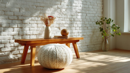 A beautifully lit living space featuring a wooden table with a decorative vase and dried flowers, accompanied by a soft floor cushion, evokes a warm and inviting atmosphere ideal for relaxation and creativity.の素材