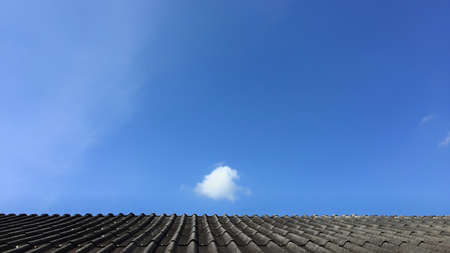 One cloud on the roof isolated on nice blue sky