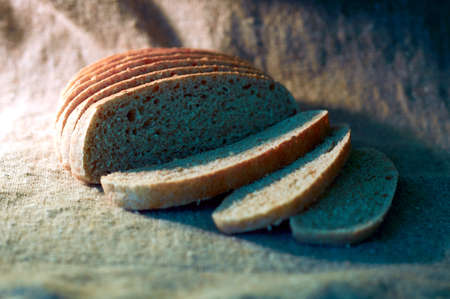 bran wheat bread in the rays of the rising sunの写真素材