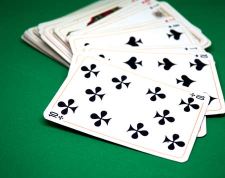 a deck of cards on the green cloth of the casinoの写真素材