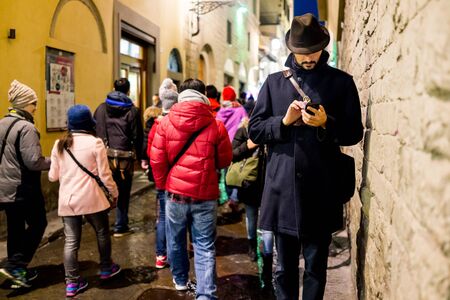 A man using a cell phone downのeditorial素材