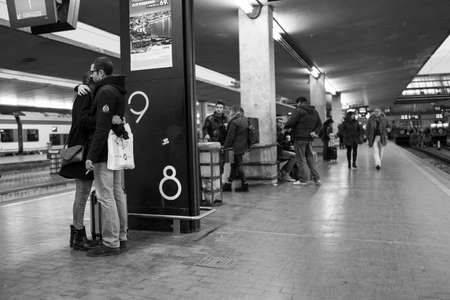 Couple hugging in train stationのeditorial素材