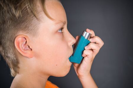 A child with an inhaler, an asthma attack, a treatment, an allergy