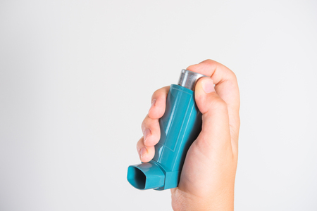 Inhaler for relief of allergy and asthma attacks in the hand close upの写真素材