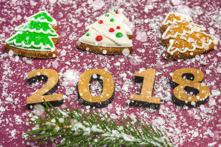 New Year card Inscription Happy new year 2018 on the background of snow and decor