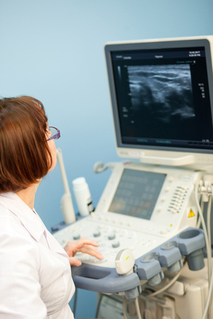 Ultrasound machine doctor"s hand usg investigation USCGの写真素材