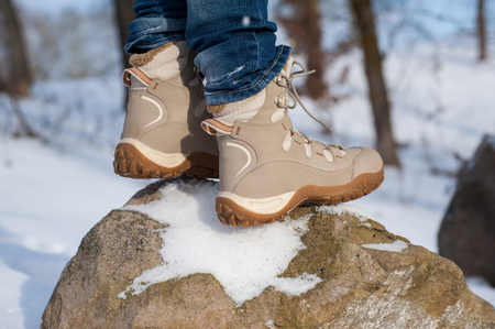 Close-up of hiking boots in the snowの写真素材