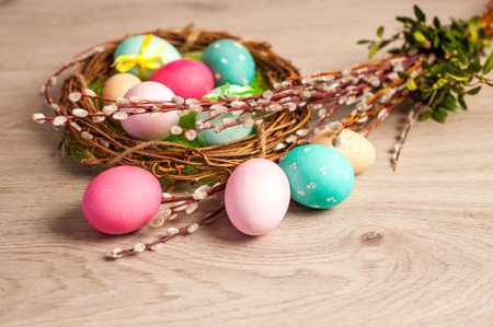 The composition of tulips of different colors on a wooden background, greeting card with free place for inscriptions on Easter or any holidayの写真素材