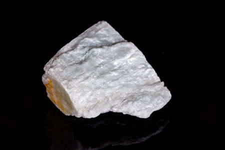 Macro mineral stone Talc on black background close upの写真素材